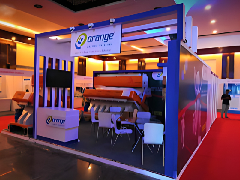 Custom Exhibition Stand Fabrication And Machinery Showcase Service For Processing Industry Orange
