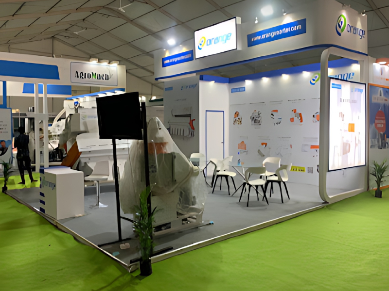 Industrial Exhibition Stand Planning And Machinery Display Service For Automation Orange